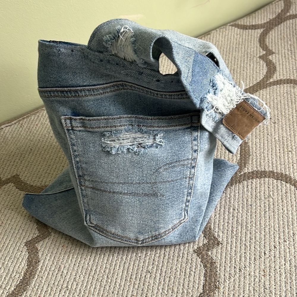 ♻️ upcycled distressed denim hand satchel bag with outer pockets on both sides